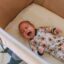 colicky baby crying in a crib